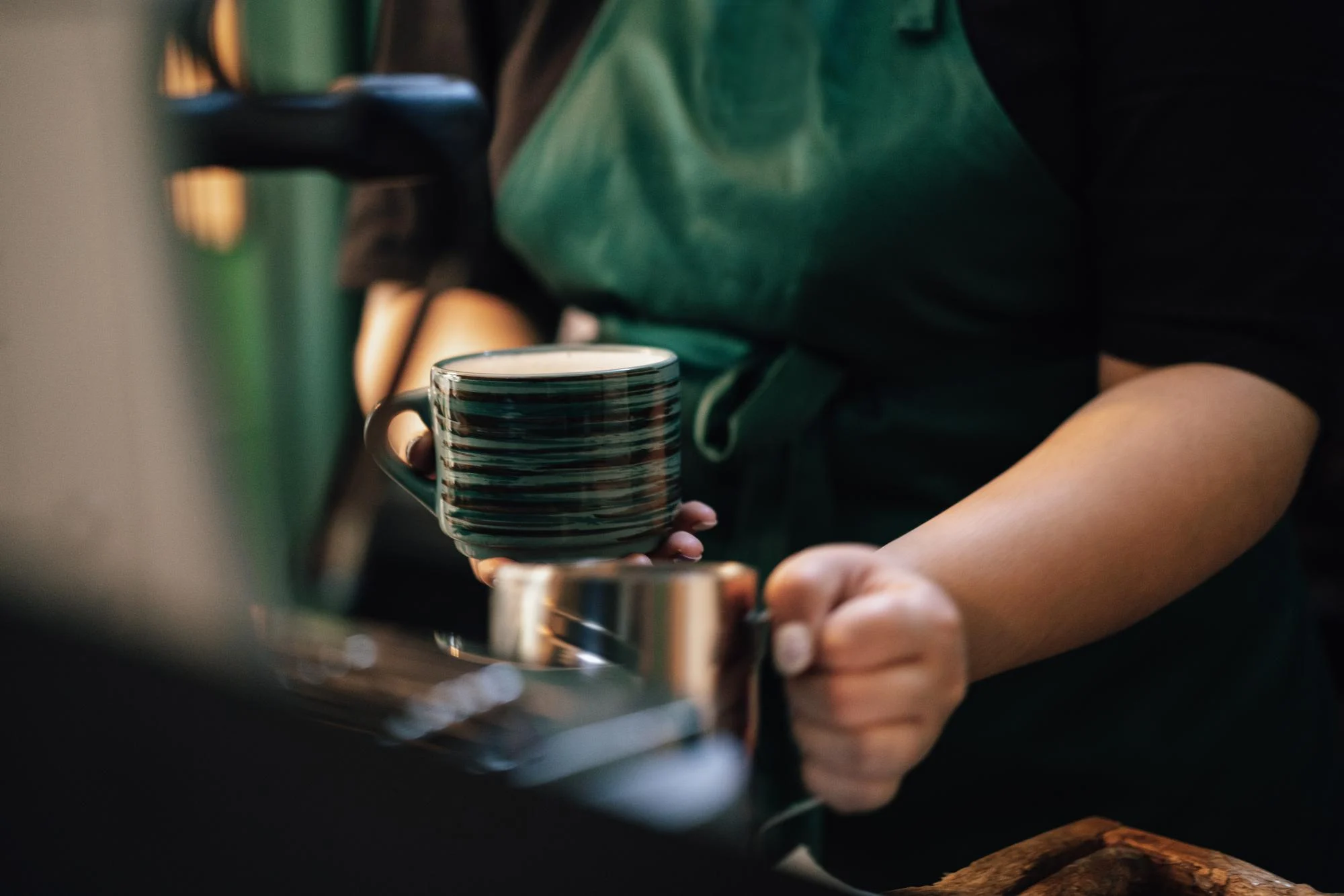 Barista holding a coffee cup