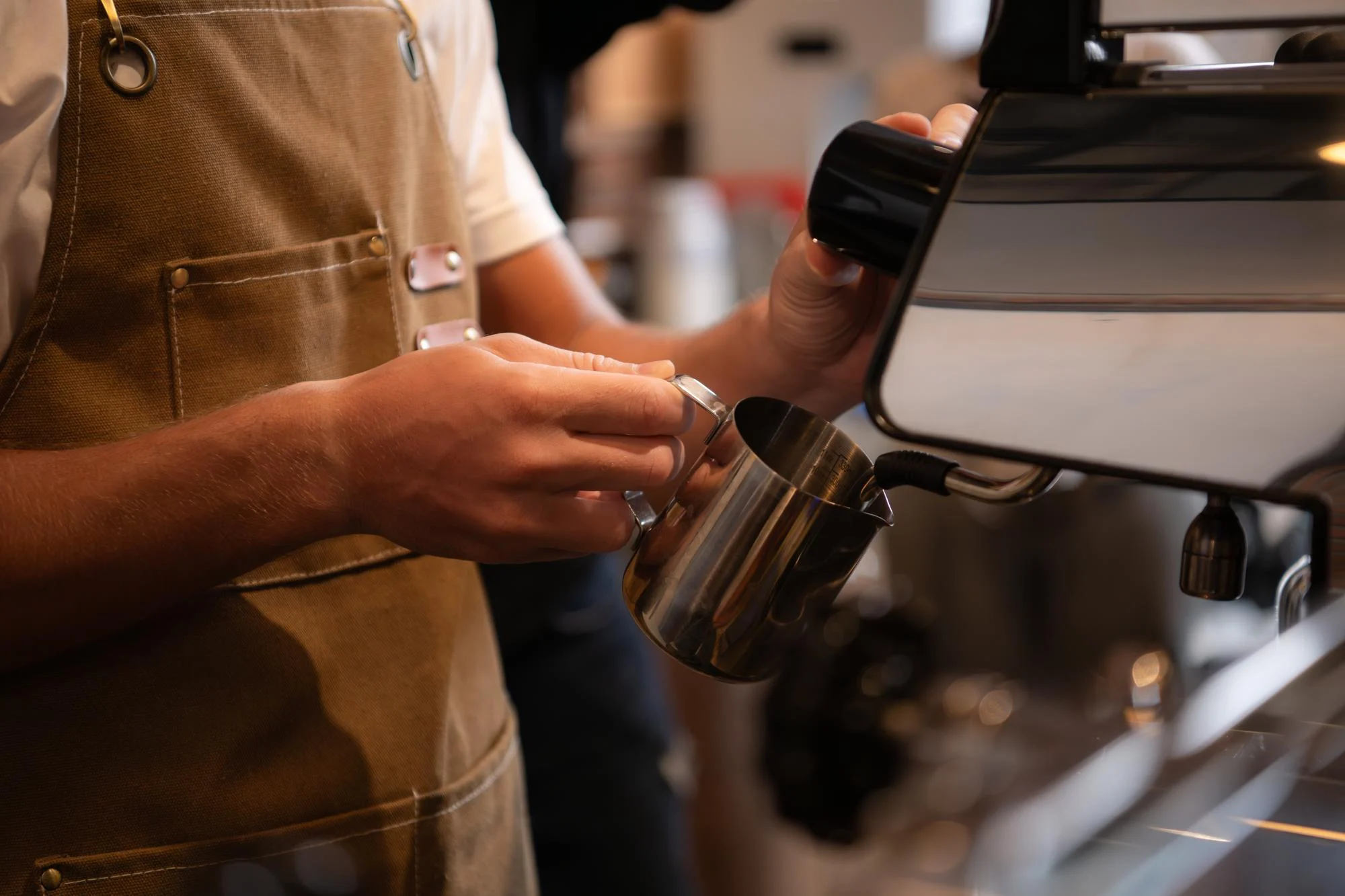 Barista preparing coffee at an espresso machine